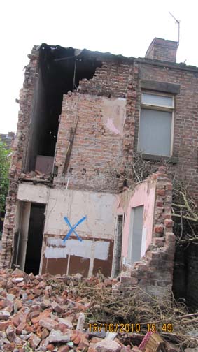 The rear of No.65 Cairns Street, smashed by contractors